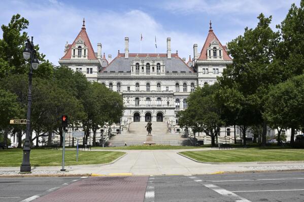 FILE - The New York state Capitol is pictured, June 30, 2022, in Albany, N.Y. New York lawmakers began voting Monday, May 1, 2023, on a $229 billion state budget due a month ago that would raise the minimum wage, alter the bail law and ban gas stoves and furnaces in new buildings. (AP Photo/Hans Pennink, File)