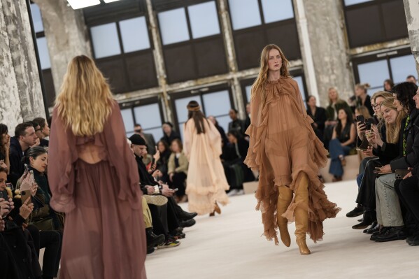 Models wear creations as part of the Chloe Fall/Winter 2024-2025 ready-to-wear collection presented Thursday, Feb. 29, 2024 in Paris. (Photo by Scott A Garfitt/Invision/AP)