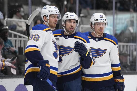 St. Louis Blues center Jordan Kyrou, middle, celebrates with left wing Pavel Buchnevich, left, and right wing Kasperi Kapanen after scoring a goal against the San Jose Sharks during the second period of an NHL hockey game in San Jose, Calif., Thursday, March 2, 2023. (AP Photo/Godofredo A. Vásquez)