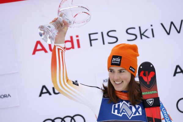 Slovakia's Petra Vlhova celebrates on the podium after winning an alpine ski, women's World Cup slalom race, in Kranjska Gora, Slovenia, Sunday, Jan. 7, 2024. (AP Photo/Giovanni Maria Pizzato)