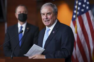 FILE - In this Sept. 21, 2021, file photo House Budget Committee Chair John Yarmuth, D-Ky., joined at left by House Intelligence Committee Chairman Adam Schiff, D-Calif., talks to reporters at the Capitol in Washington.  Yarmuth, who as chairman of the House Budget Committee has played a key role in pushing for President Joe Biden's efforts to expand the nation's social safety net, announced Tuesday, Oct. 12,  that he will not seek another term next year.(AP Photo/J. Scott Applewhite, File)