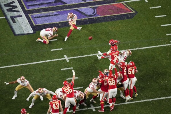 San Francisco 49ers kicker Jake Moody, top center, kicks a field goal against the Kansas City Chiefs during overtime of the NFL Super Bowl 58 football game Sunday, Feb. 11, 2024, in Las Vegas. (AP Photo/David J. Phillip)