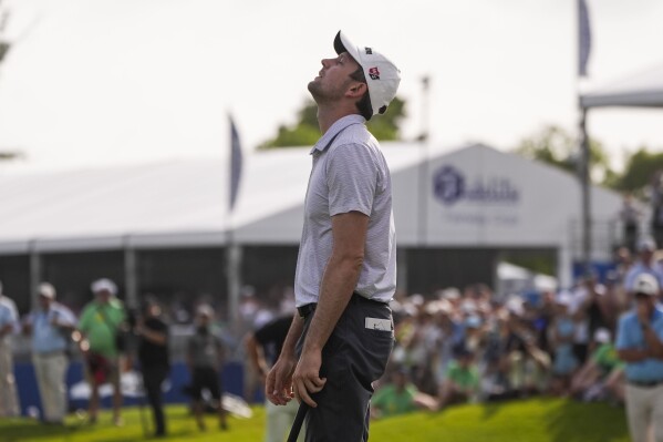 Martin Trainer reacts after missing his putt on the 18th green during a playoff for the PGA Zurich Classic golf tournament at TPC Louisiana in Avondale, La., Sunday, April 28, 2024. The team of Rory McIlroy, of Northern Ireland, and Shane Lowry, of Ireland, defeated Trainer and teammate Chad Ramey to win the tournament. (AP Photo/Gerald Herbert)