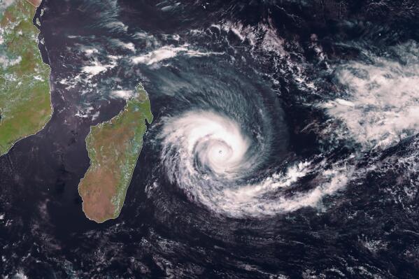 In this image supplied by EUMETSAT from satellite Meteosat 8 taken at 09.15 UTC on Wednesday, Feb. 2, 2022, Cyclone Batsirai is seen to the east of Madagascar. Forecasts say Tropical Cyclone Batsirai is increasing in intensity and is expected to pass north of the Indian Ocean island nation of Mauritius on Wednesday evening and make landfall in central Madagascar on Saturday afternoon. (EUMETSAT via AP)