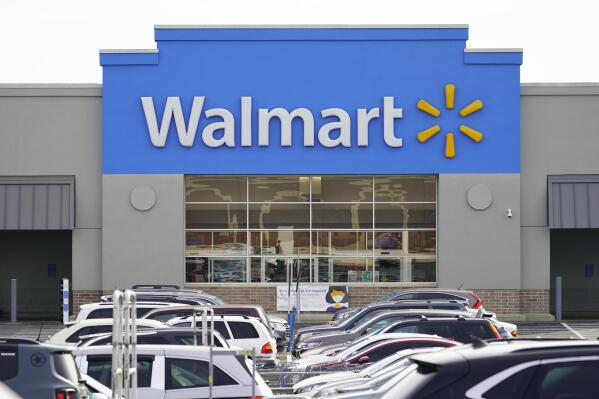 FILE - Cars fill up a parking lot in a Walmart location in Philadelphia on Nov. 17, 2021. The Federal Trade Commission said Tuesday, June 28, 2022, that it has sued Walmart for allegedly allowing its money transfer services to be used by scam artists who stole “hundreds of millions of dollars" from customers. (AP Photo/Matt Rourke, File)