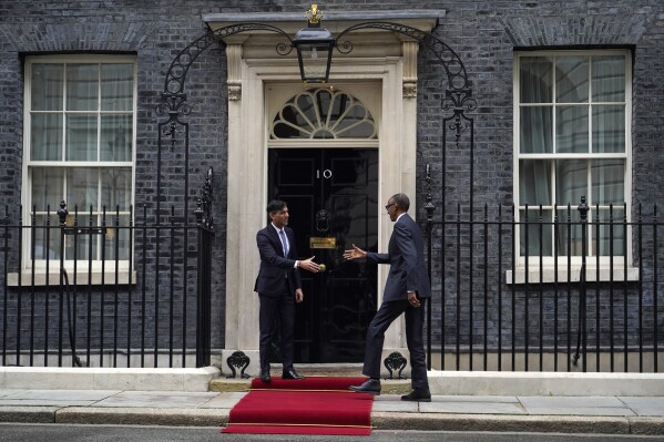 Britain's Prime Minister Rishi Sunak, left, greets the President of Rwanda Paul Kagame on the doorstep of 10 Downing Street in London, Tuesday, April 9, 2024. (AP Photo/Alberto Pezzali)