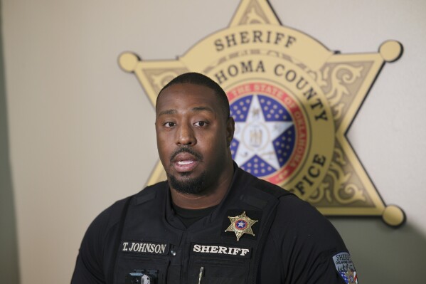 Oklahoma County Sheriff Tommie Johnson III announces during a news conference in Oklahoma City, Wednesday, Aug. 30, 2023, that a 15-year-old boy has been arrested in the fatal shooting of a 16-year-old at a Choctaw High School shooting on Friday, Aug. 25, during a football game against Del City High School. (Doug Hoke/The Oklahoman via AP)