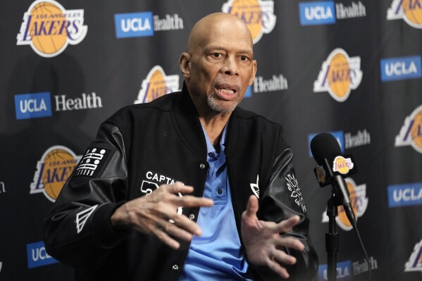 Kareem Abdul-Jabbar speaks during a news conference prior to an NBA basketball game between the Los Angeles Lakers and the Milwaukee Bucks Thursday, Feb. 9, 2023, in Los Angeles. Kareem Abdul-Jabbar fell at a concert in Los Angeles and broke his hip. The NBA Hall of Famer was attending a show Friday night Dec. 15, 2023 when he was injured. Paramedics at the undisclosed venue responded and the 76-year-old was transported to a hospital for treatment. (AP Photo/Mark J. Terrill)
