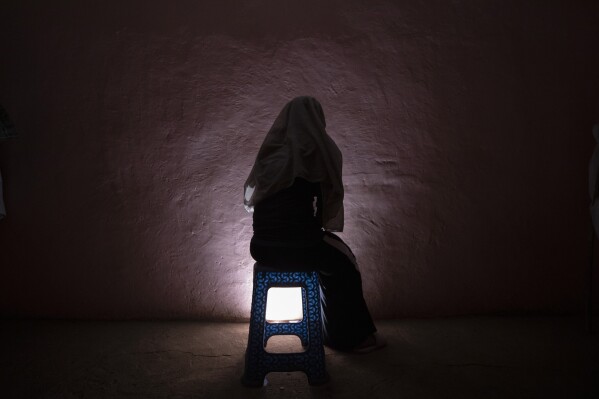 FILE - A Tigrayan refugee rape victim who fled the conflict in Ethiopia's Tigray sits for a portrait in eastern Sudan near the Sudan-Ethiopia border, March 20, 2021. A new study of medical records released Thursday, Aug. 24, 2023 shows that at least 128 women and girls were sexually assaulted in Ethiopia’s northern Tigray region even after a peace agreement ended a two-year conflict there. Most were sexually assaulted by multiple people, and almost all believe their attackers belonged to military groups. (AP Photo/Nariman El-Mofty, File)