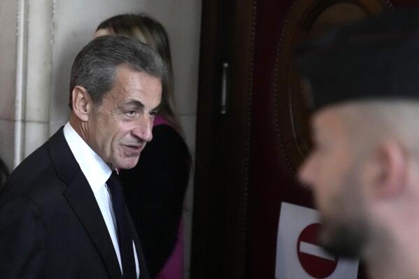 FILE - Former French President Nicolas Sarkozy arrives at the courtroom for his appeal trial of trying to bribe a magistrate in exchange for information about a legal case in which he was implicated Monday, Dec. 5, 2022 in Paris. A French appeals court on Wednesday May 17, 2023 upheld a one-year prison sentence for former President Nicolas Sarkozy on a conviction for corruption and influence peddling. (AP Photo/Francois Mori, File)
