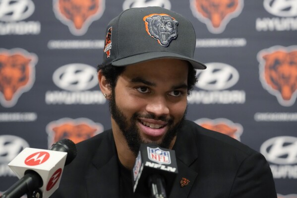 Chicago Bears No. 1 draft pick quarterback Caleb Williams listens to reporters during an NFL football news conference in Lake Forest, Ill., Friday, April 26, 2024. (AP Photo/Nam Y. Huh)