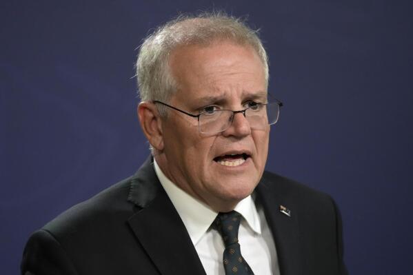 Australian Prime Minister Scott Morrison talks about the situation in Ukraine at a press conference in Sydney, Feb. 23, 2022. Former prime minister Morrison quietly gave himself extra powers during the coronavirus pandemic by signing himself as minister for several portfolios – something few people knew about. (AP Photo/Rick Rycroft)