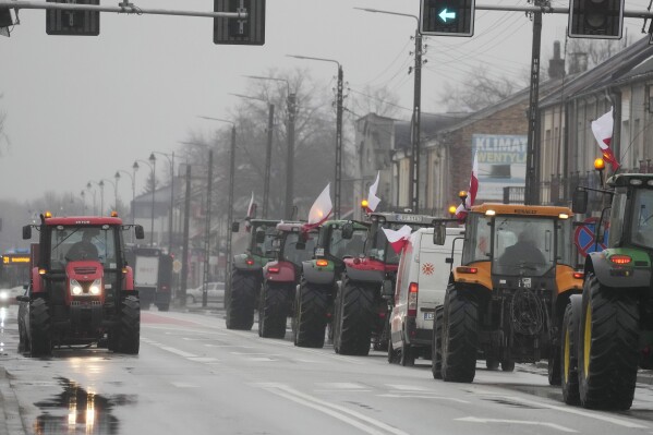 FILE - Protesting farmers in Poland drive tractors slowly on a road in Devlin, Poland, blocking traffic and drawing attention to disagreements over European Union regulations, Wednesday, Jan. 24, 2024. It's arousing. Such protests were held throughout Poland.  (AP Photo/Czarek Sokolowski, File)