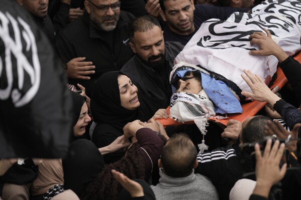 Palestinians attend funerals of five militants killed in clashes with Israeli forces in Tulkarem, West Bank, Wednesday, Nov. 22, 2023. (AP Photo/Majdi Mohammed)