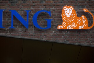 FILE - The logo of Dutch ING sits on one of it's bank buildings in Amsterdam, Netherlands, on Jan. 9, 2014. Dutch bank ING announced Wednesday Dec. 20, 2023 that it is accelerating its phasing out of funding for oil and gas exploration and production activities while it increases financing for renewable energy. (AP Photo/Peter Dejong, File)