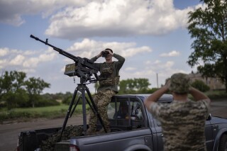 Ukrainian anti-drone unit servicemen search for Russian drones, in Avdiivka direction, Ukraine, Monday, May 6, 2024. Social media users are falsely claiming that France sent troops to fight with Ukraine against Russia. (AP Photo/Francisco Seco)