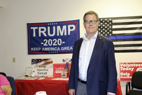 Dean Black, the chair of the Duval County Republican Party, poses for a photo at party headquarters in Jacksonville, Fla., on Thursday, Oct. 22, 2020. (AP Photo/Bobby Caina Calvan)