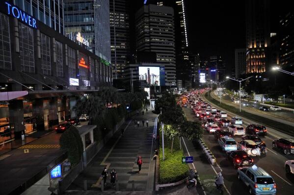 Lines of cars are seen during rush hour traffic at the main business district in Jakarta, Indonesia, Monday, Jan. 9, 2023. Population and economic growth in Indonesia are expected to triple the country's energy consumption by 2050. (AP Photo/Dita Alangkara)