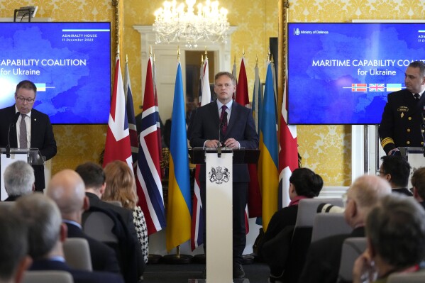 Britain's Defence Secretary Grant Shapps, centre, takes part in a press conference with Norway's Minister of Defence Bjorn Arild Gram, left, and Vice Admiral Oleksii Neizhpapa of Ukraine, right, in London, Monday, Dec. 11, 2023. Britain's Ministry of Defense is transferring two minehunting ships to Ukraine as part of a package of long-term support to bolster security in the Black Sea. The transfer comes as Britain and Norway announce plans for a new maritime coalition to increase support for Ukraine in the war with Russia. (AP Photo/Kirsty Wigglesworth)