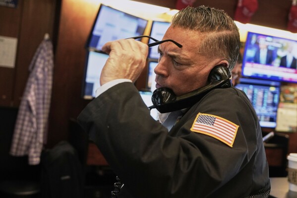 Trader Jonathan Mueller works on the floor of the New York Stock Exchange, Thursday, April 10, 2025. (AP Photo/Richard Drew)