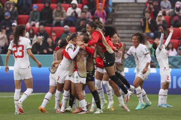 Morocco players celebrate following the Women's World Cup Group H soccer match between South Korea and Morocco in Adelaide, Australia, Sunday, July 30, 2023. (AP Photo/James Elsby)