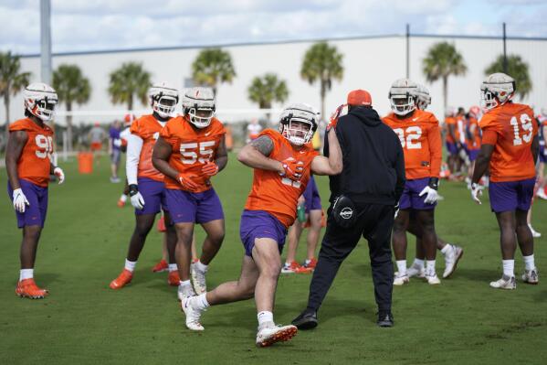 Clemson Tigers defensive tackle Bryan Bresee (11) participates in a drill during a practice session ahead of the 2022 Orange Bowl, Wednesday, Dec. 28, 2022, in Fort Lauderdale, Fla. Clemson will face the Tennessee Volunteers in the Orange Bowl on Friday, Dec. 30. (AP Photo/Rebecca Blackwell)