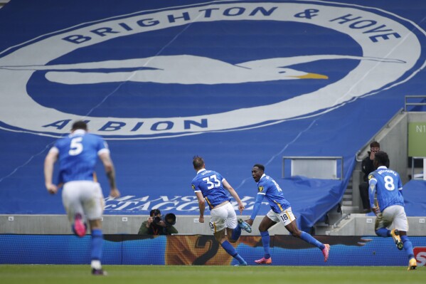 FILE - Brighton's Danny Welbeck, second right, celebrates after scoring his side's second goal during the English Premier League soccer match between Brighton and Hove Albion and Leeds United at the Falmer stadium in Brighton, England, Saturday, May 1, 2021. Premier League club Brighton posted an after-tax profit of 122.8 million pounds ($154.4 million) for the 2022-23 season on Tuesday, April 2, 2204. (John Sibley/Pool Photo via AP, File)