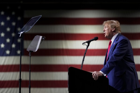 FILE - Former President Donald Trump speaks during a rally Sunday, Dec. 17, 2023, in Reno, Nev. The Colorado Supreme Court on Tuesday, Dec. 19, declared Trump ineligible for the White House under the U.S. Constitution’s insurrection clause and removed him from the state’s presidential primary ballot, setting up a likely showdown in the nation’s highest court to decide whether the front-runner for the GOP nomination can remain in the race. (AP Photo/Godofredo A. Vásquez, File)