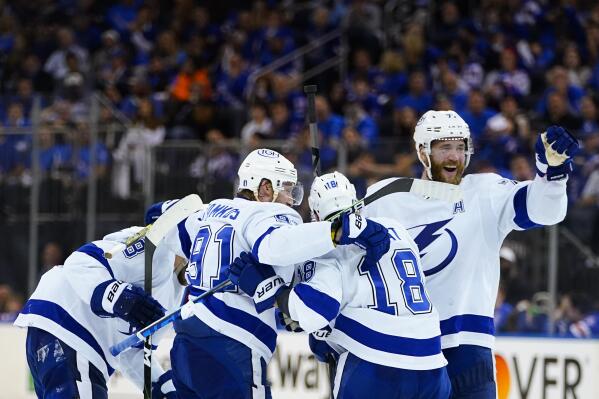 The Tampa Bay Lightning celebrate a goal during the third period against the New York Rangers in Game 5 of the NHL Hockey Stanley Cup playoffs Eastern Conference Finals, Thursday, June 9, 2022, in New York (AP Photo/Frank Franklin II)