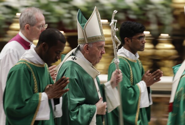 Pope Francis leaves after celebrating an opening Mass for the Amazon synod, in St. Peter's Basilica, at the Vatican, Oct. 6, 2019. (AP Photo/Andrew Medichini, File)