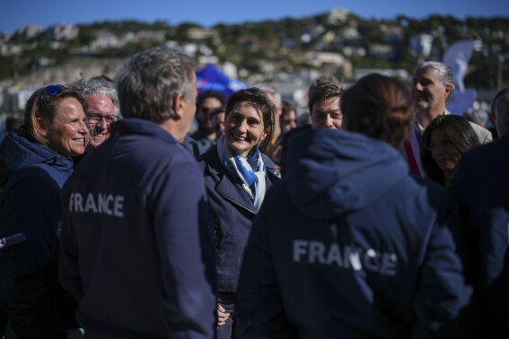 French Sports Minister Amelie Oudea-Castera attends the inauguration of the Roucas Blanc Marina constructed for the upcoming summer Olympic Games in Marseille, southern France, Tuesday, April 2, 2024. Marseille will host the Olympic sailing events during the Paris 2024 Olympic Games that run from July 26 to Aug.11, 2024. (AP Photo/Daniel Cole)