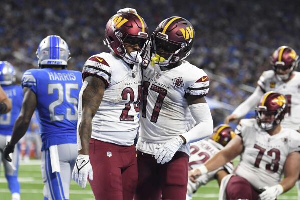 Washington Commanders running back Antonio Gibson (24) runs