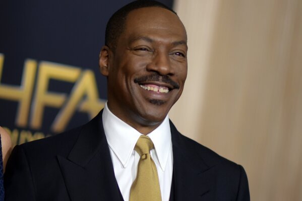 FILE - This Nov. 6, 2016 file photo shows Eddie Murphy at the 20th annual Hollywood Film Awards in Beverly Hills, Calif.  Murphy will host "Saturday Night Live" on Dec. 21, marking the former cast member’s first hosting appearance since 1984. (Photo by Richard Shotwell/Invision/AP, File)