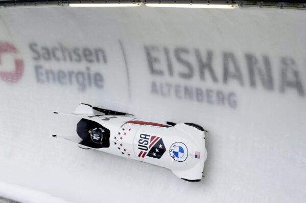 Third placed Kaillie Humphries and and Jasmine Jones from the USA speed down the track during the women's two-man Bobsleigh World Cup race in Altenberg, Germany, Sunday, Jan. 15, 2023. (Sebastian Kahnert/dpa via AP)