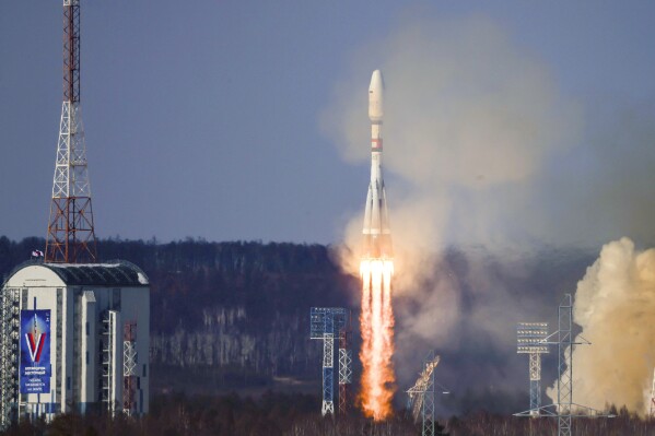 In this photo released by Roscosmos space corporation on Thursday, Feb. 29, 2024, the Soyuz-2.1b rocket blasts off at the Vostochny cosmodrome outside the city of Tsiolkovsky, about 200 kilometers (125 miles) from the city of Blagoveshchensk in the far eastern Amur region, Russia. A Russian Soyuz rocket successfully put an Iranian satellite into orbit along with 18 Russian satellites on Thursday. (Roscosmos space corporation via 麻豆传媒app)