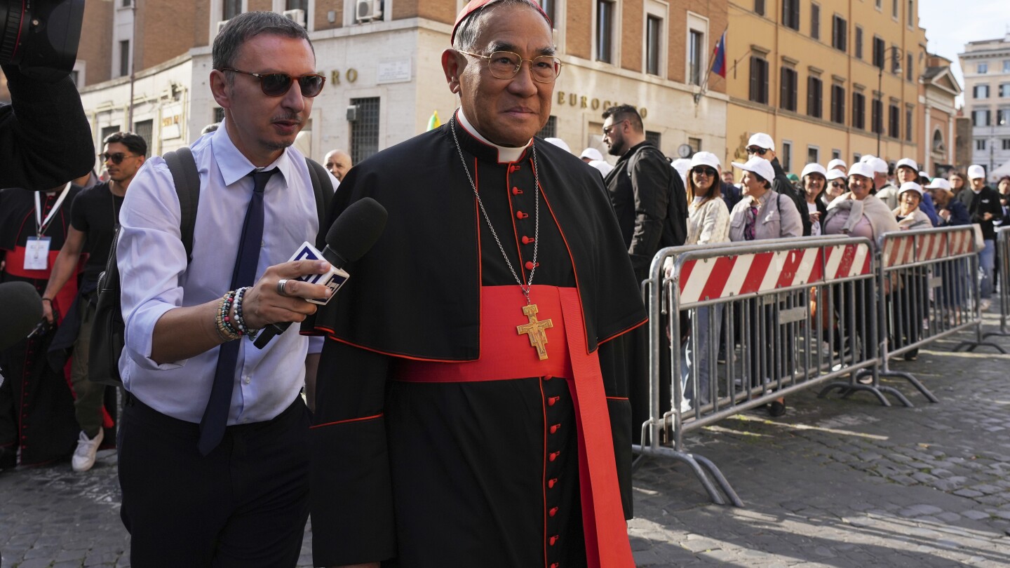 Vatican workers install Sistine Chapel stove where ballots are burned during conclave to elect pope