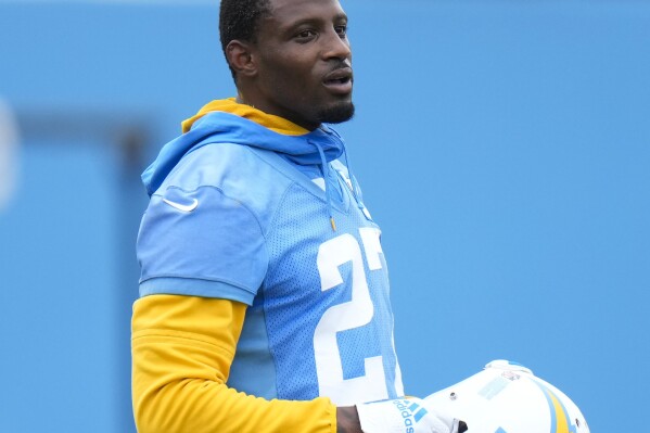 FILE - Los Angeles Chargers cornerback J.C. Jackson stands on the field during the NFL football team's camp in Costa Mesa, Calif., Wednesday, June 14, 2023. An arrest warrant has been issued for Jackson after he failed to appear for a court hearing on traffic charges in Massachusetts. (AP Photo/Jae C. Hong, File)