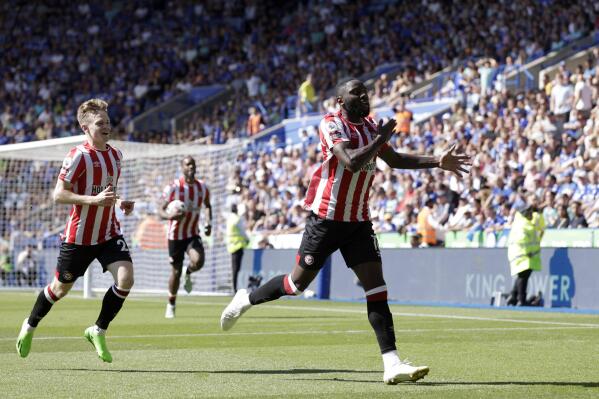 Brentford's Josh Dasilva, right, celebrates scoring his side's second goal of the game to make the score 2-2 during the English Premier League soccer match between Leicester City and Brentford at the King Power Stadium, Leicester, England, Sunday, Aug, 7, 2022. (Richard Sellers/PA via AP)