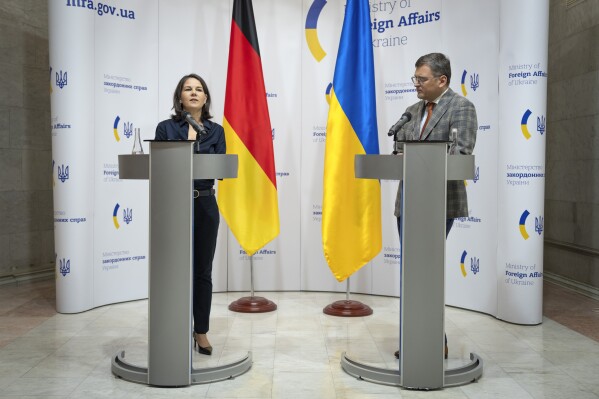 German Foreign Minister Annalena Baerbock, left, and Ukrainian Foreign Minister Dmytro Kuleba attend joint news conference following their talks in Kyiv, Ukraine, Monday, Sept. 11, 2022. (AP Photo/Efrem Lukatsky/Pool)