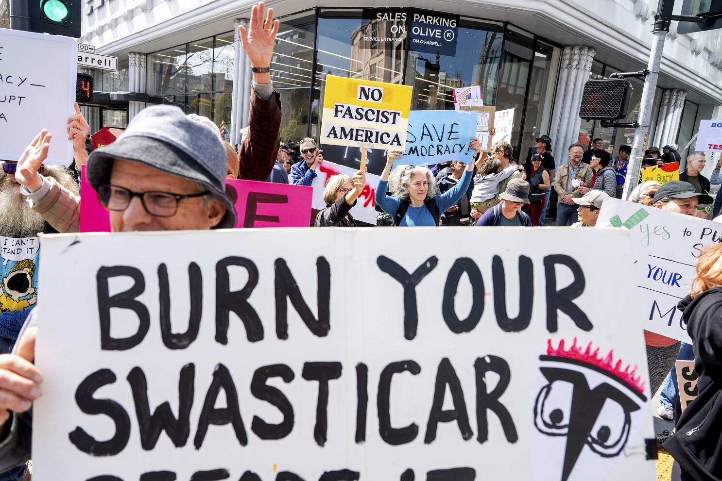 Protesters rebelling against Musk's DOGE swarm Tesla showrooms