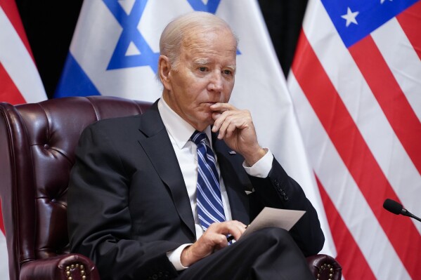 FILE - President Joe Biden listens as he and Israeli Prime Minister Benjamin Netanyahu participate in an expanded bilateral meeting with Israeli and U.S. government officials, Wednesday, Oct. 18, 2023, in Tel Aviv. For the second time this month, the Biden administration is bypassing Congress to approve an emergency weapons sale to Israel. The State Department said Friday, Dec. 29, that Secretary of State Antony Blinken had told Congress that he had made a second emergency determination covering a $147.5 million sale for equipment that is needed to make the 155 mm shells that Israel has already purchased function. (AP Photo/Evan Vucci, File)