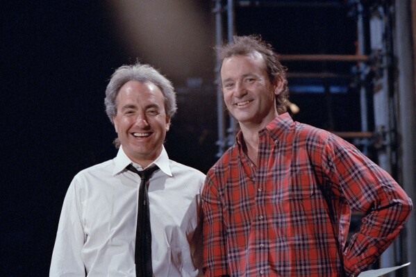 "Saturday Night Live" host Bill Murray, a former cast member, is pictured with producer Lorne Michaels, left, during rehearsals on March 19, 1987, in New York. (AP Photo/G. Paul Burnett, File)