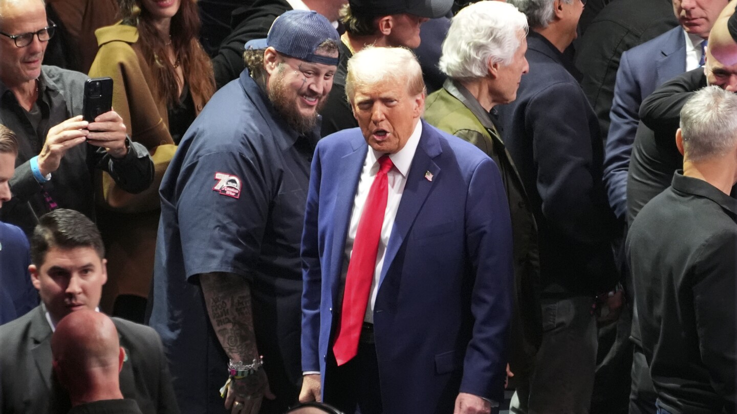 Trump takes a break from making Cabinet picks and attends UFC championship fight in New York