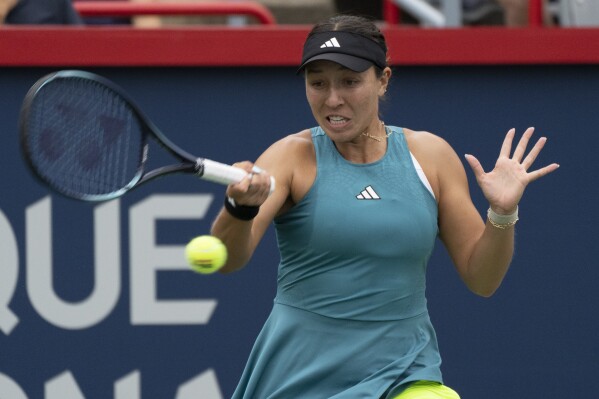 Jessica Pegula, of the United States, hits a return to Liudmila Samsonova, of Russia, in the women's final of the National Bank Open tennis tournament in Montreal, Sunday, Aug. 13, 2023. (Christinne Muschi/The Canadian Press via AP)