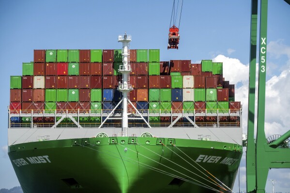 Shipping containers line the Ever Most cargo vessel docked at the Port of Oakland on Thursday, April 3, 2025, in Oakland, Calif. (AP Photo/Noah Berger)