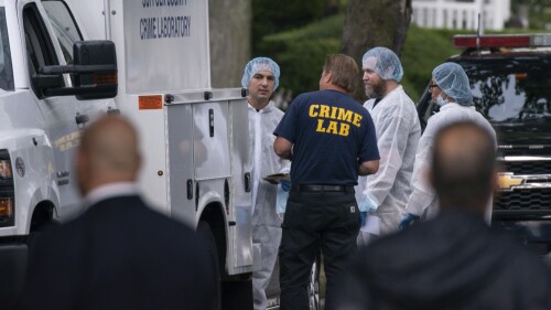 Crime laboratory officers arrive to the house where a suspect has been taken into custody on New York's Long Island in connection with a long-unsolved string of killings, known as the Gilgo Beach murders, Friday, July 14, 2023, in Massapequa Park, N.Y. (AP Photo/Eduardo Munoz Alvarez)
