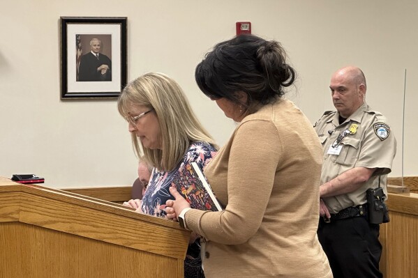 Penny Laperriere, left, speaks to a judge in Howell, Mich., Friday, May 10, 2024, about the death of her husband from a tainted steroid injection in 2012. Specialty pharmacy executive Barry Cadden was sentenced to at least 10 years in prison for the deaths of 11 people who were injected with tainted pain medication, part of a meningitis outbreak that affected hundreds across the U.S. in 2012. (AP Photo/Ed White)