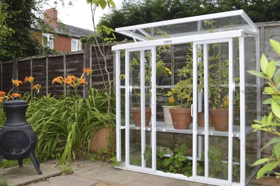 This image provided by Hartley Botanic shows a Patio model glasshouse with its hinged top pane open. (Hartley Botanic via AP)