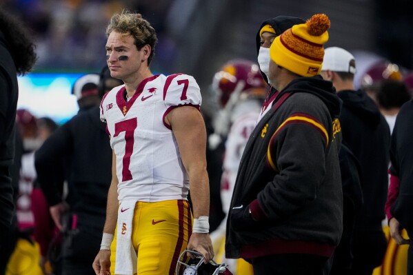 Southern California quarterback Miller Moss (7) looks on from the sideline during the first half of an NCAA college football game against Washington, Saturday, Nov. 2, 2024, in Seattle. (AP Photo/Lindsey Wasson)