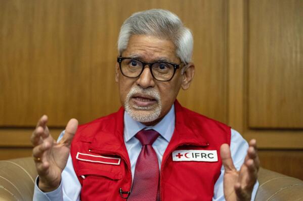 Jagan Chapagain, Secretary-General of the International Federation of Red Cross and Red Crescent Societies (IFRC) speaks during an interview with The Associated Press in Beirut, Lebanon, Thursday, Feb. 16, 2023. Syria could face dangerous outbreaks of disease in the wake of last week's devastating earthquake if hundreds of thousands of displaced people do not get permanent housing soon, Chapagain said Friday. (AP Photo/Hassan Ammar)